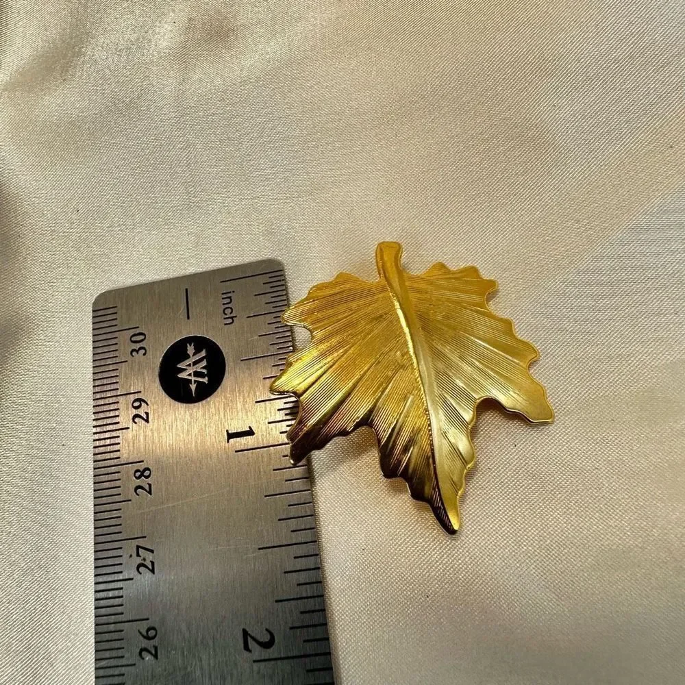 Gold tone leaf pin